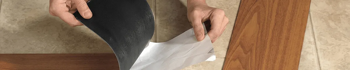A professional installing vinyl flooring in Tempe, AZ